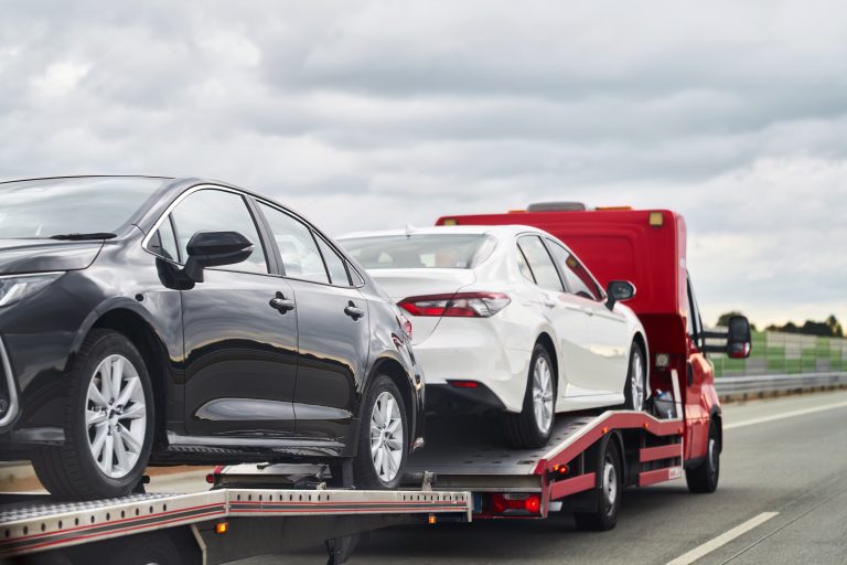 tow-truck-with-broken-car-road-tow-truck-transporting-car-highway-car-service-transportation-concept-roadside-rescue